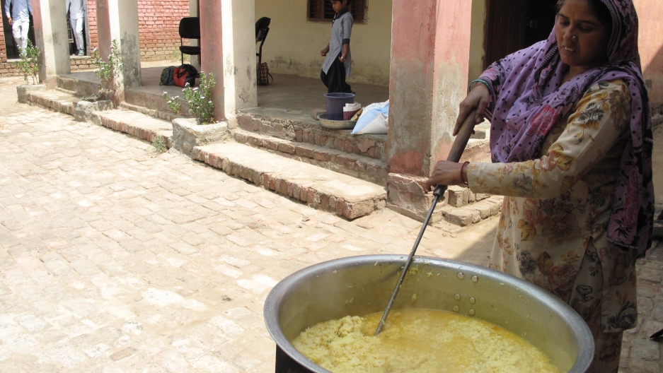 Every school serves a different meal each day of the week. The menu for the day is khichdi, a dish made with rice, lentils and vegetables. Every school serves a different meal each day of the week. The menu for the day is khichdi, a dish made with rice, lentils and vegetables.